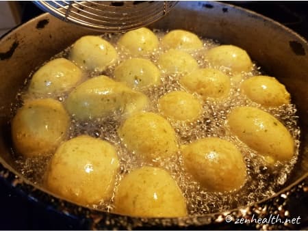 Floating dough balls in oil