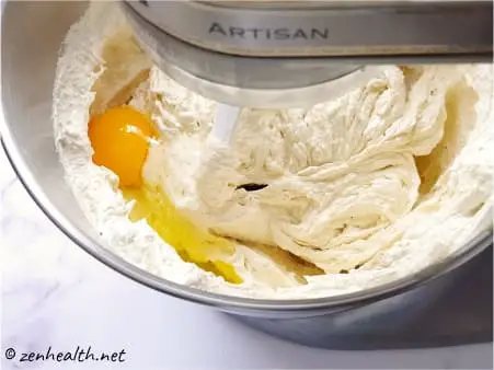 mixing eggs into batter